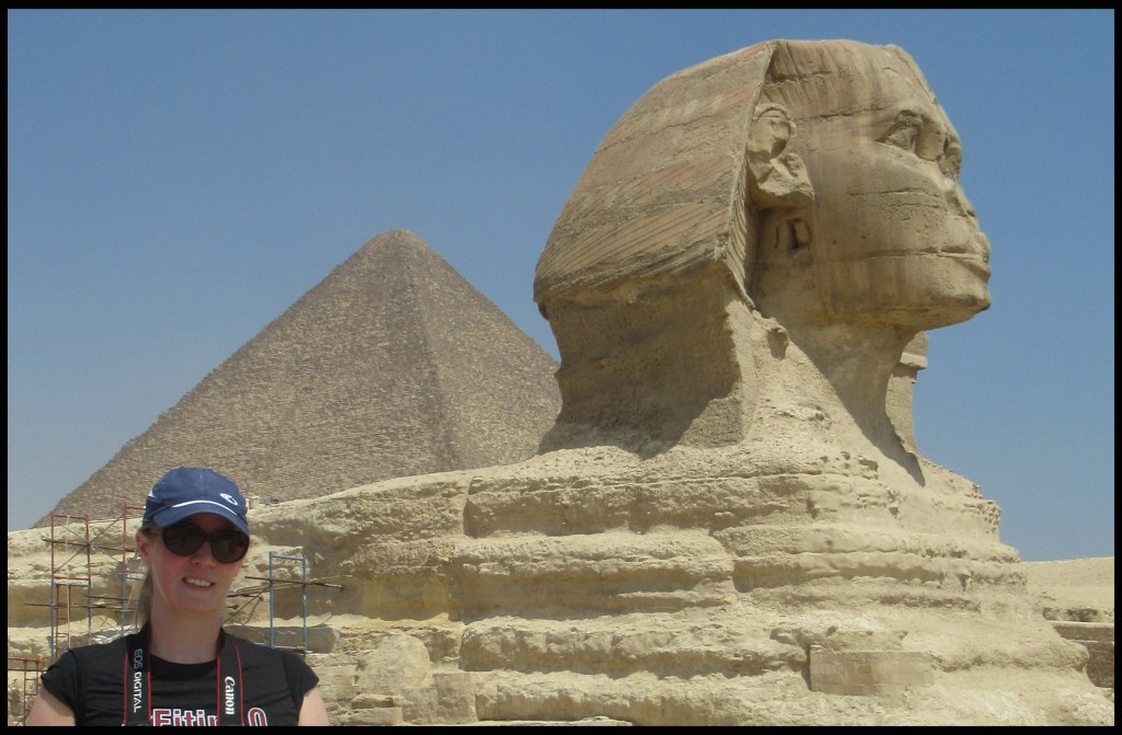 Christine Johnston with the Sphinx and Pyramids at Giza