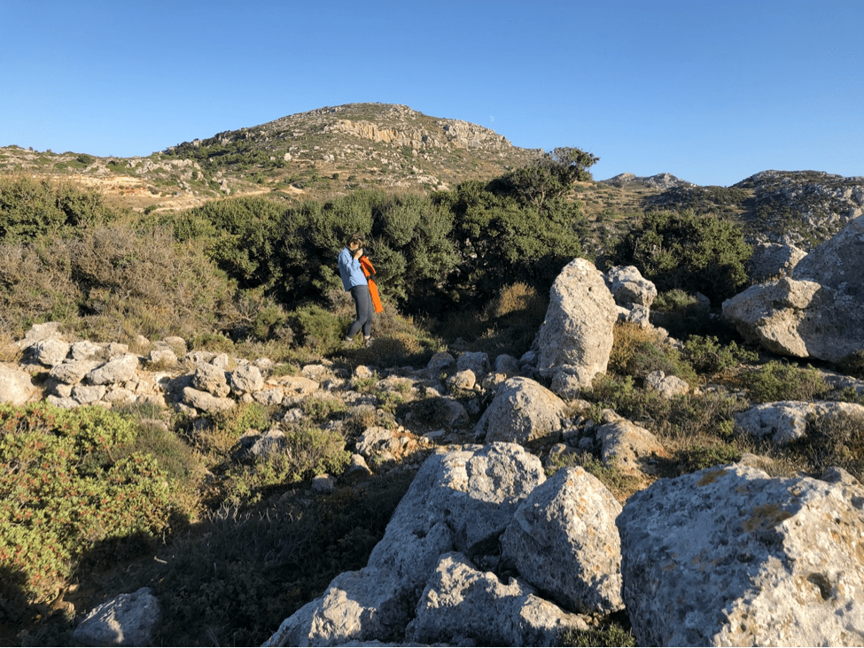 The author photographing ancient walls on a site visit in the Mirabello region, East Crete (photo credit: A. Crowe)
