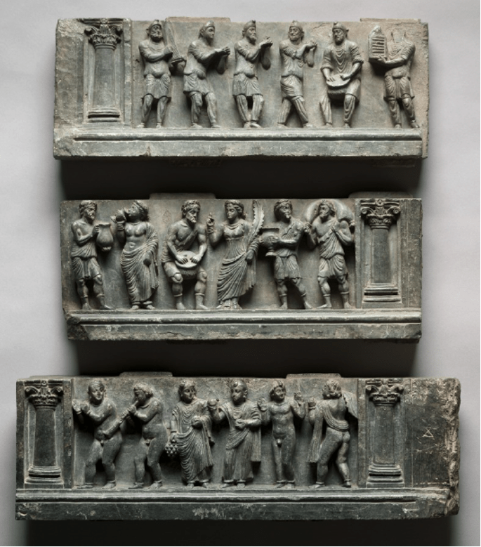 Reliefs from a Gandharan Buddhist stupa in Buner region at Cleveland Museum of Art showing various groups of people, Scythians, Greeks, and local monks, drinking, dancing, and playing music. CC0 1.0 License.