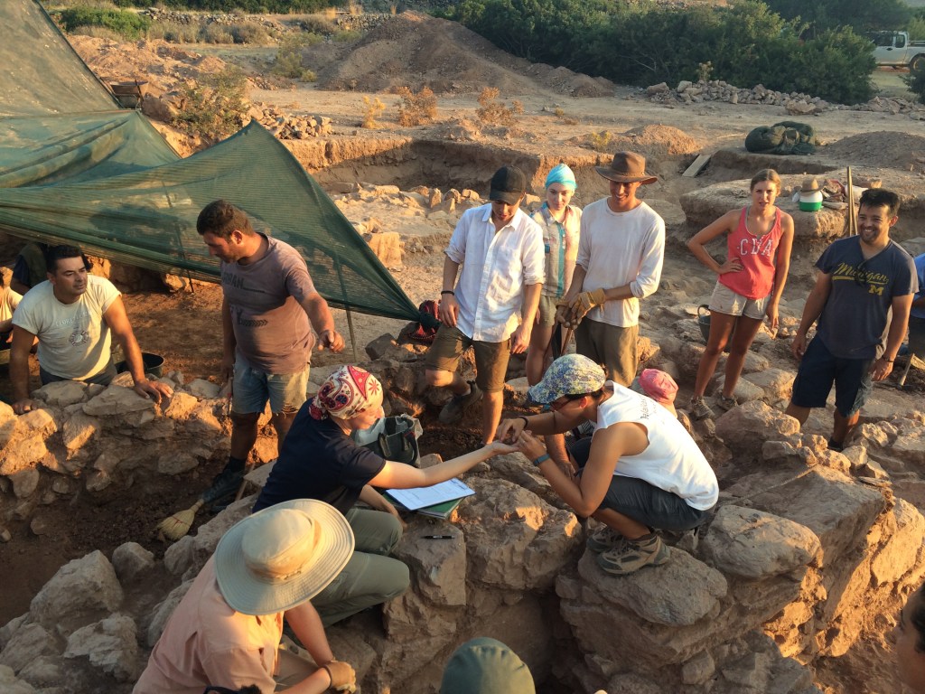 Uncovering a miniature pot during excavations at Palaikastro, Crete in June 2015. Photograph by the author. 