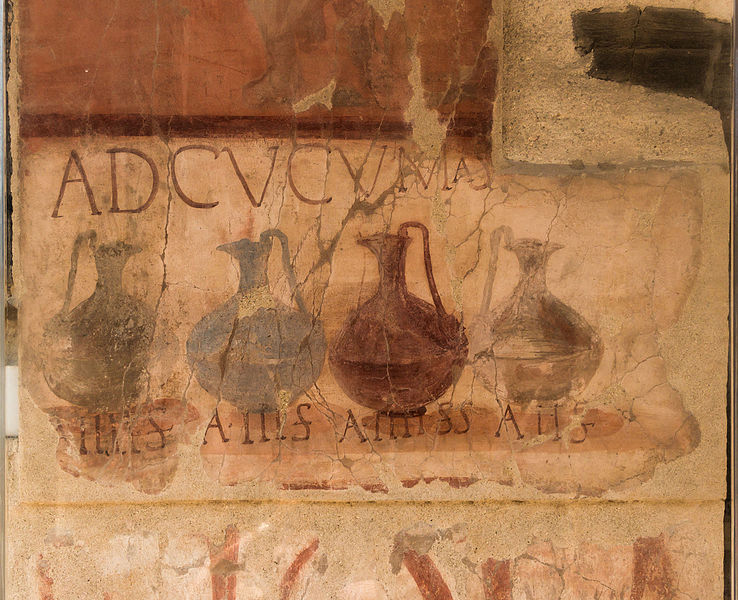 A painted advertisement on an ancient wall from Herculaneum. I depicts four wine-pouring vessels with a Latin inscriptions that reads, "Ad Cucumas". Translation: “to the cups (or cooking vessels)."
