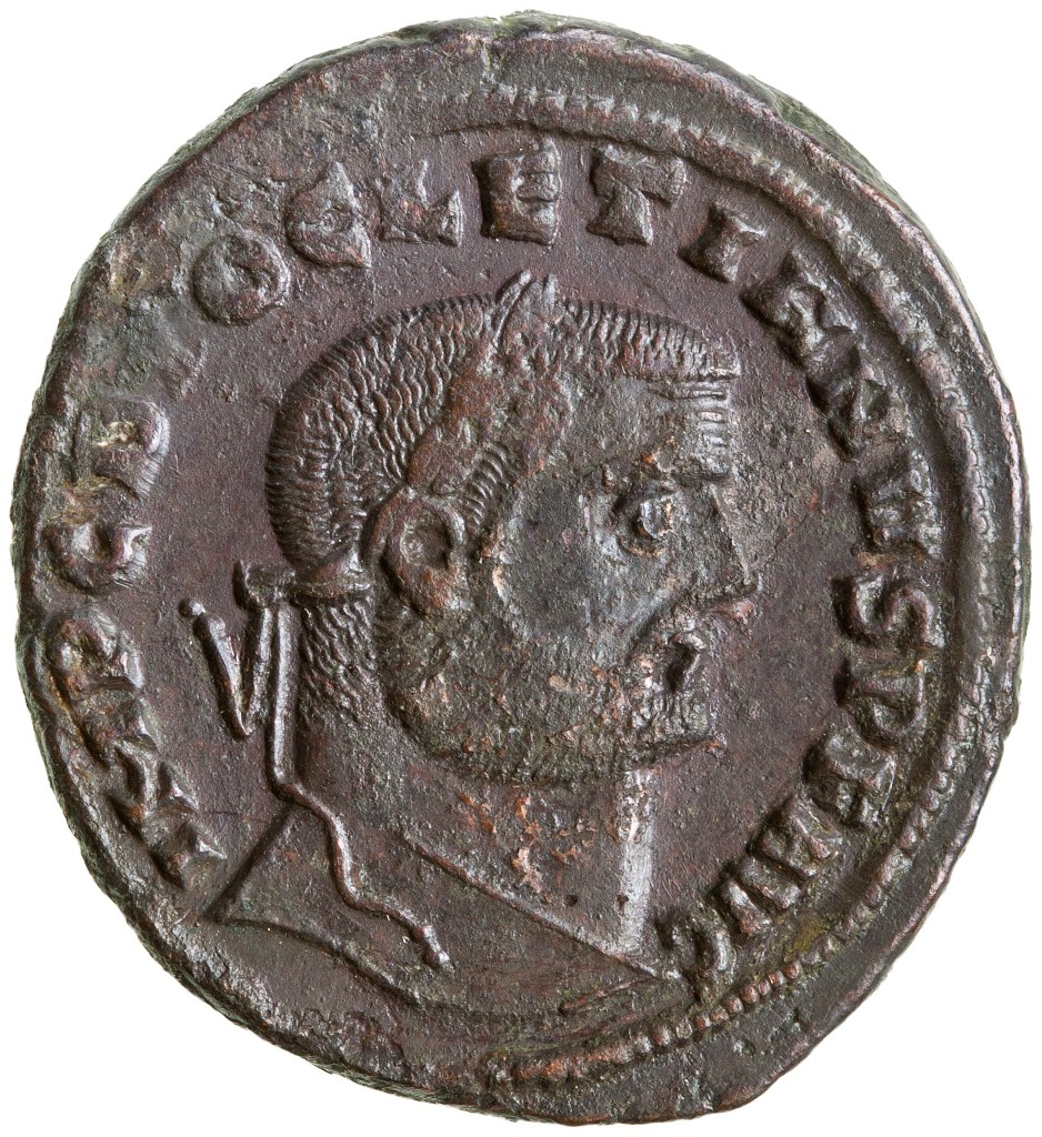 Bronze coin with the head of Diocletian in profile. There is a Latin inscription around the outside of the coin, which reads: IMP C DIOCLETIANVS P F AVG.
