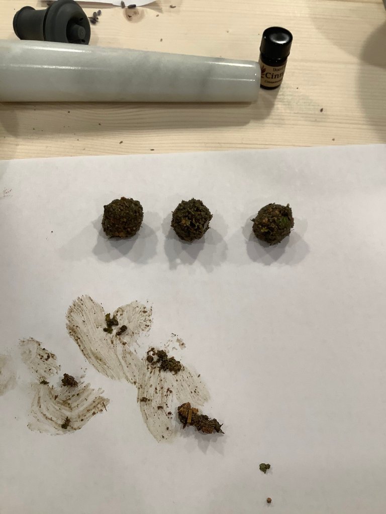 Incense ingredients rolled up into three small balls.