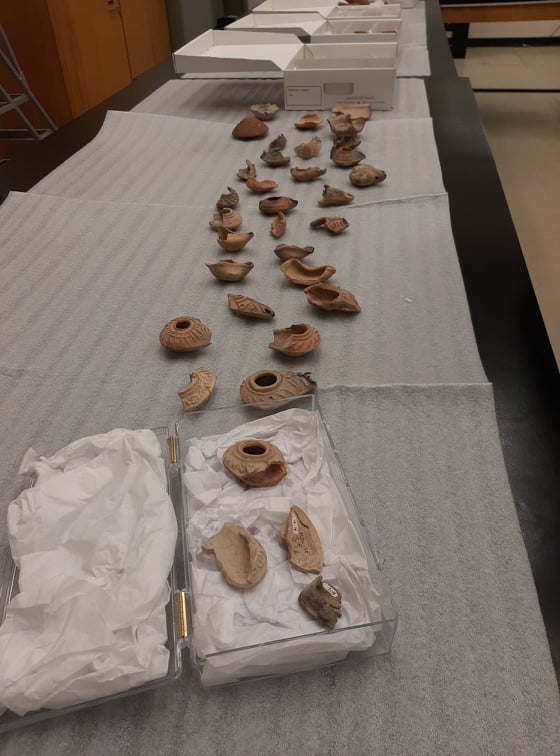 Lamps from the collection spread out across a long table.