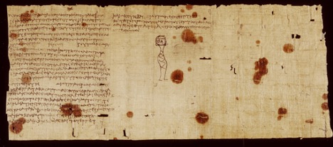 A fragment of a papyrus scroll with Greek writing and a drawing of an individual whose face is the same right side up as it is upside down. 