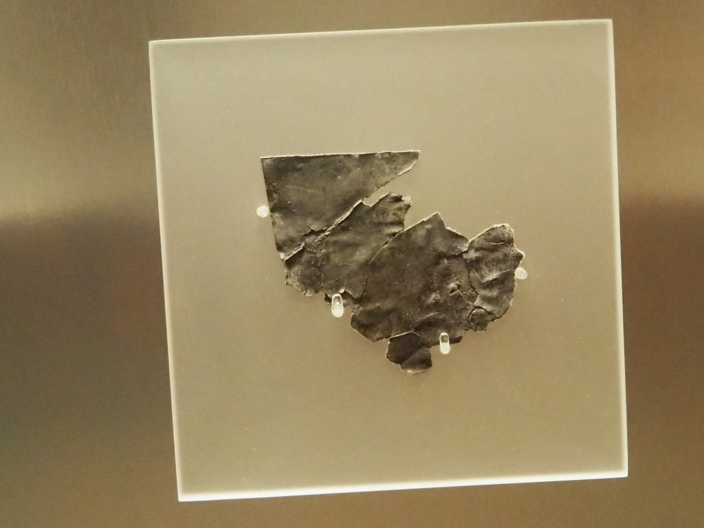 Fragment of a lead curse tablet. 