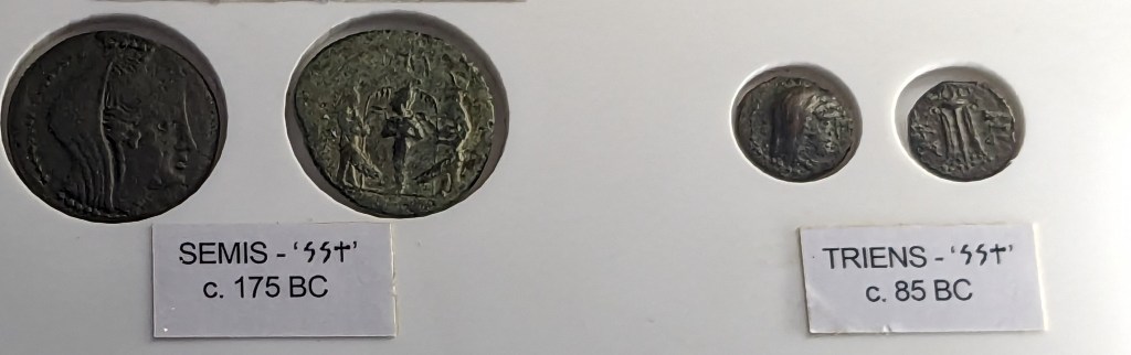 Photograph of two sets of coins.