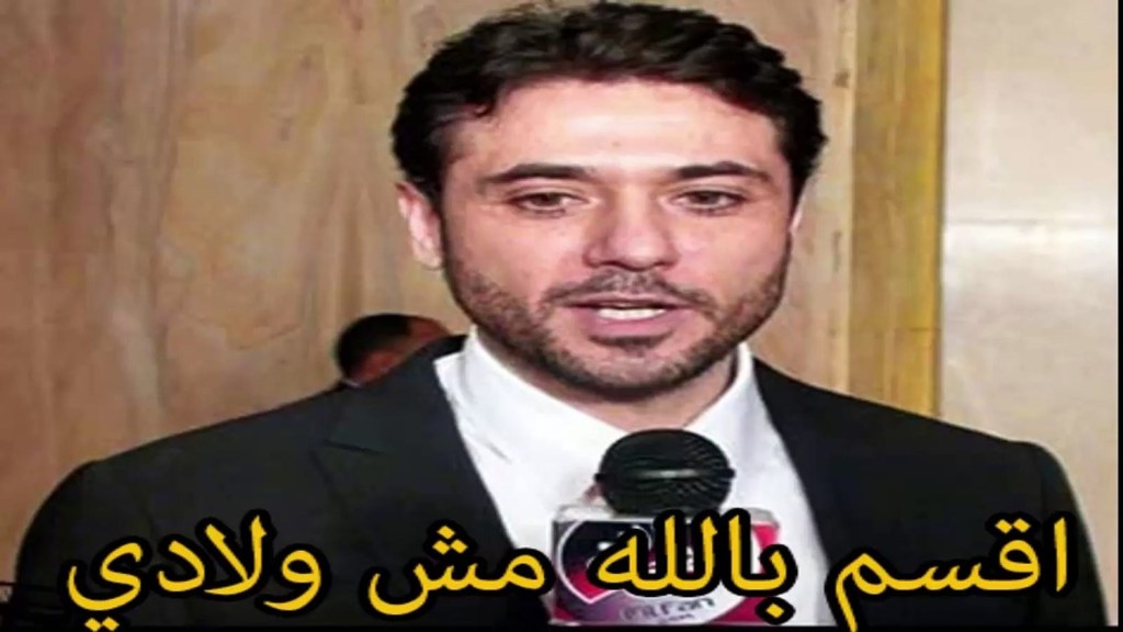 an Egyptian meme with a man in a tuxedo hold a microphone. There is Arabic text along the bottom.